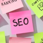 SEO checklist with sticky notes displaying SEO, ranking, content, backlinks, indexing keywords, on-page SEO, and site architecture concepts.